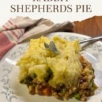 Homemade rabbit shepherd’s pie with savory ground rabbit, peas, carrots, and creamy mashed potatoes served on a plate