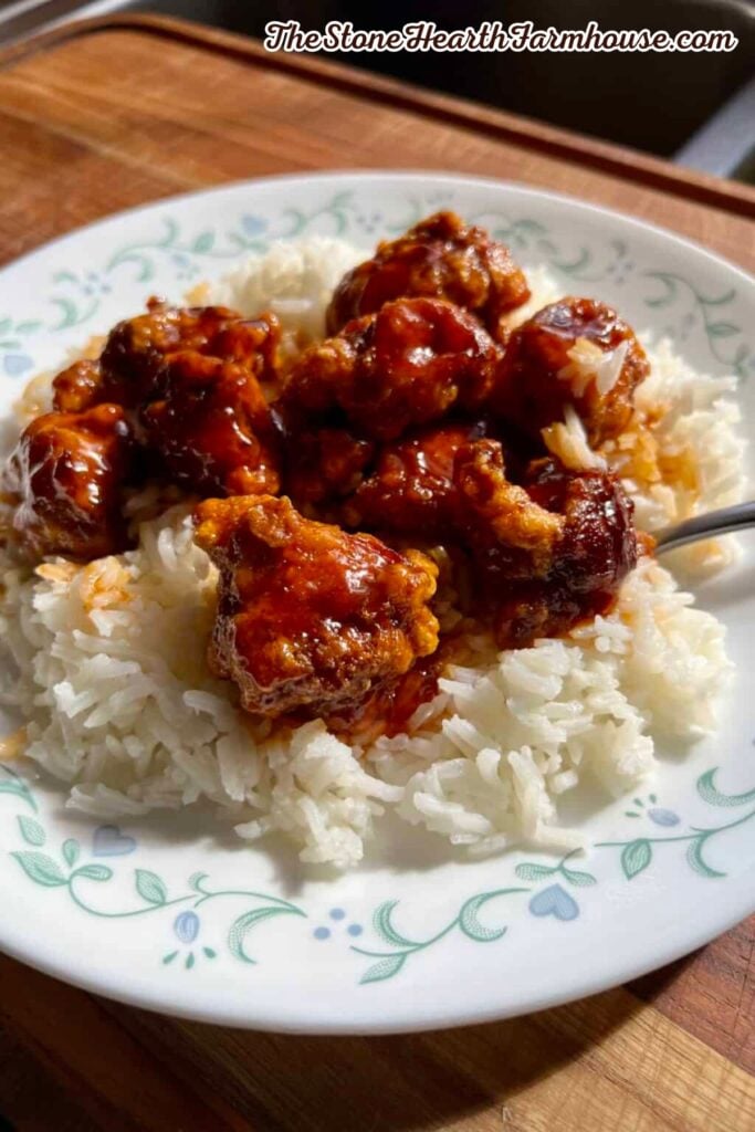 Firecracker rabbit served over fluffy white rice for a flavorful rabbit dinner recipe