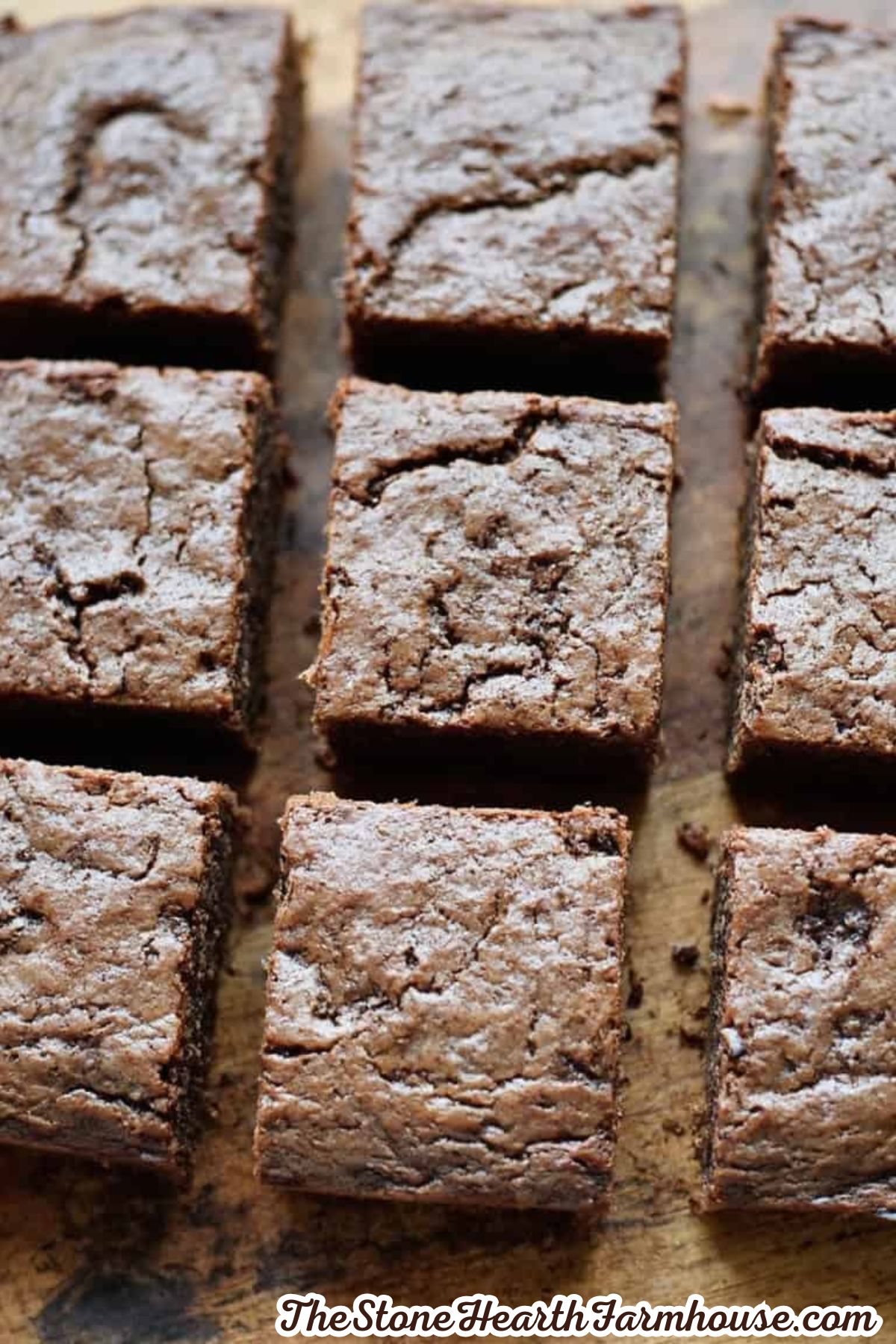 Freshly baked chocolate brownies dusted with powdered sugar and cut into squares