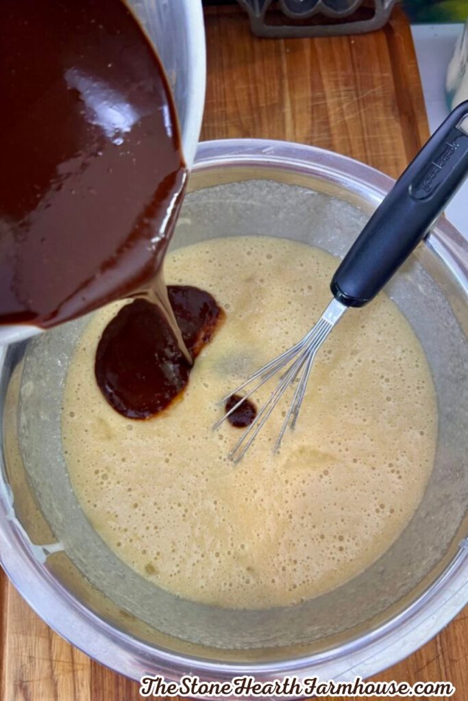 Melted chocolate mixture poured into the sourdough brownie batter