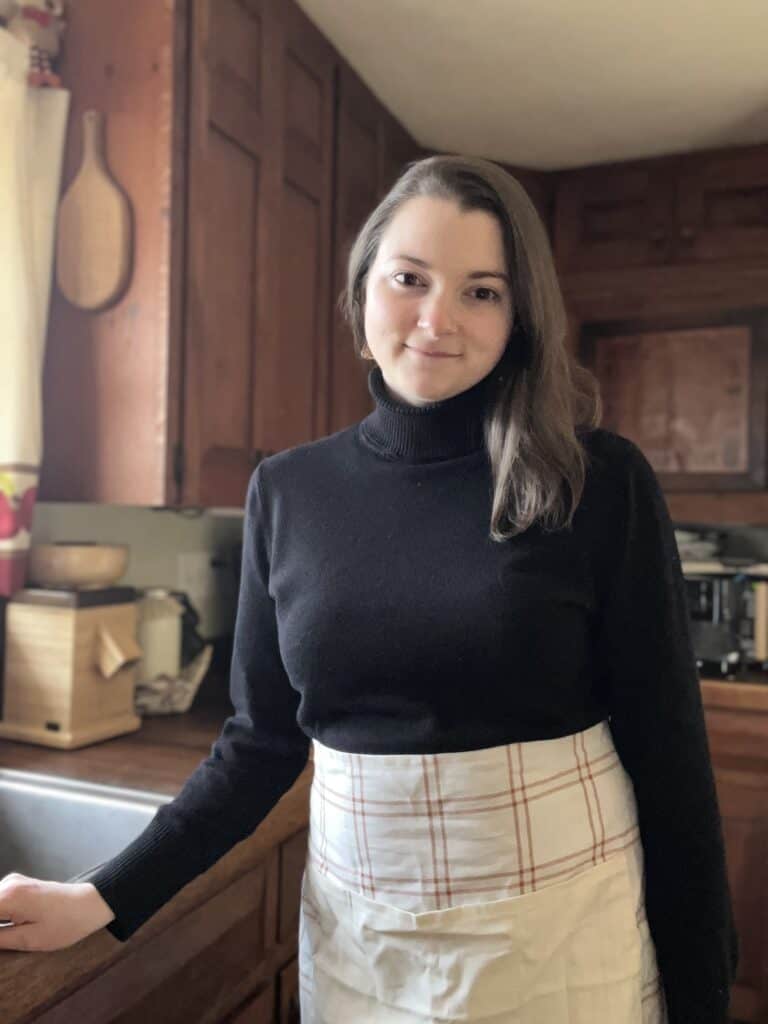 Young women in the kitchen smiling