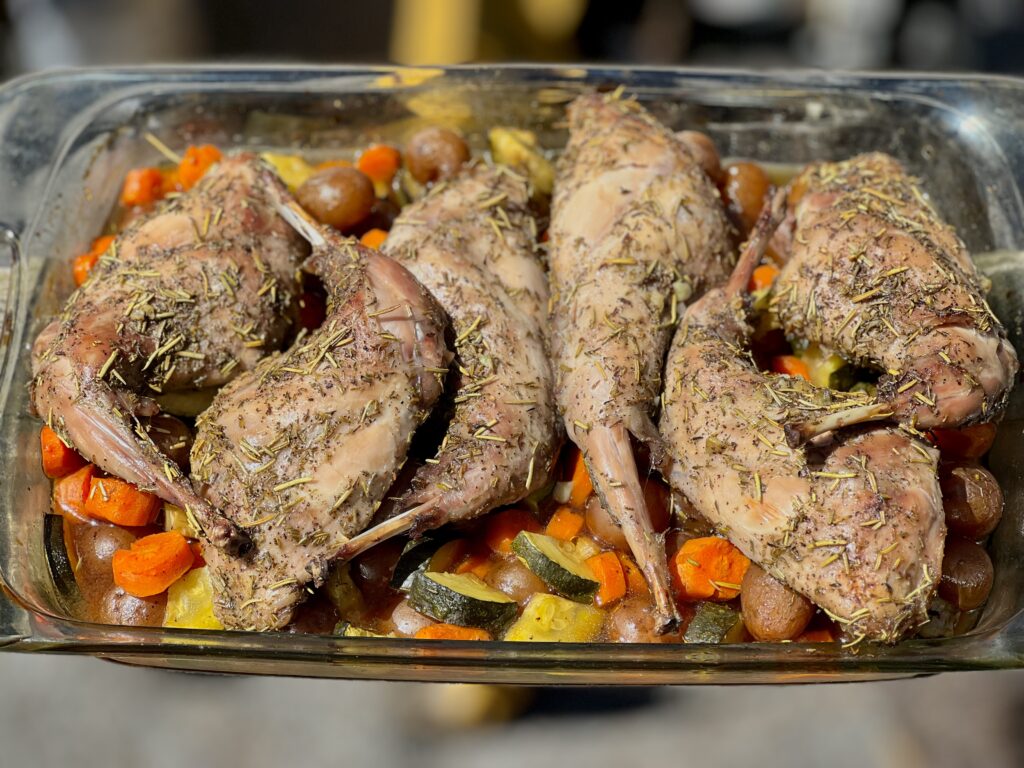 cooked roasted rabbit and vegetables.