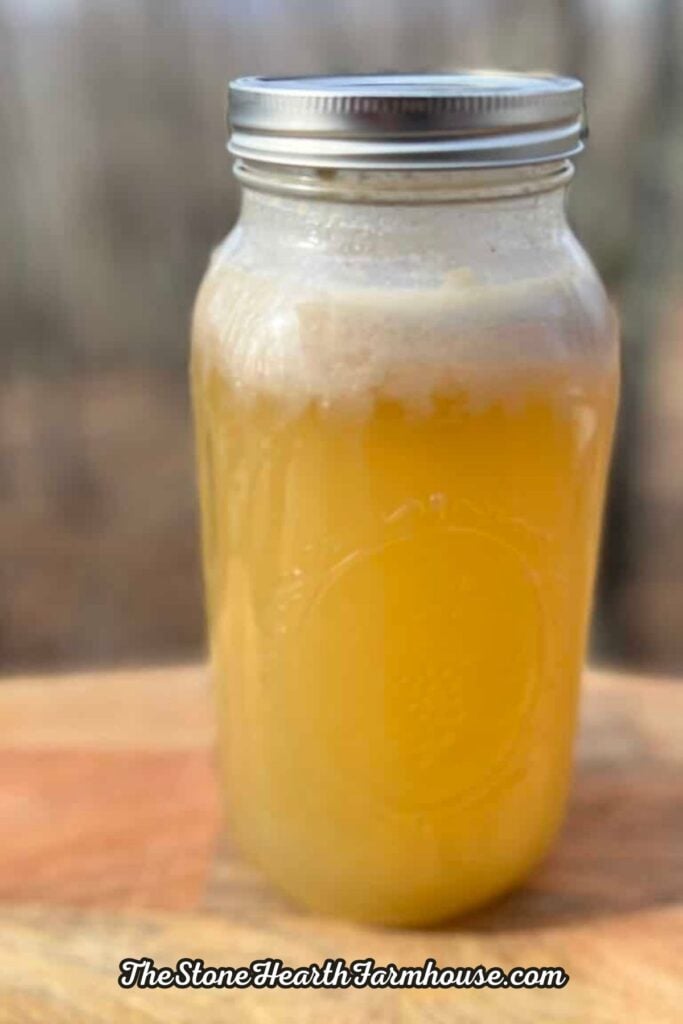 a half gallon mason jar full of rabbit bone broth