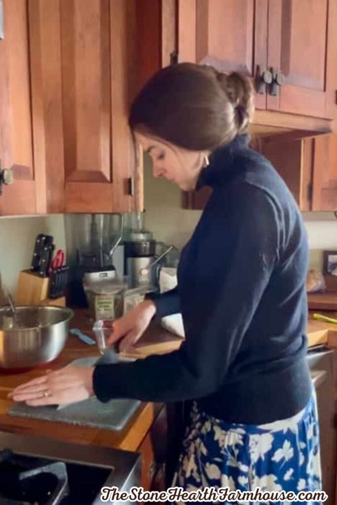 Homemade granola bars cooking in a cast iron skillet on a farmhouse kitchen stove