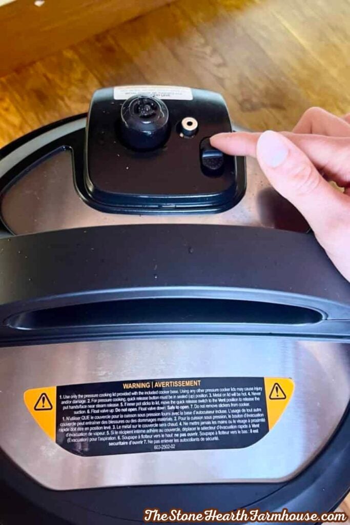 Instant Pot lid showing the pressure release valve being adjusted after cooking eggs.
