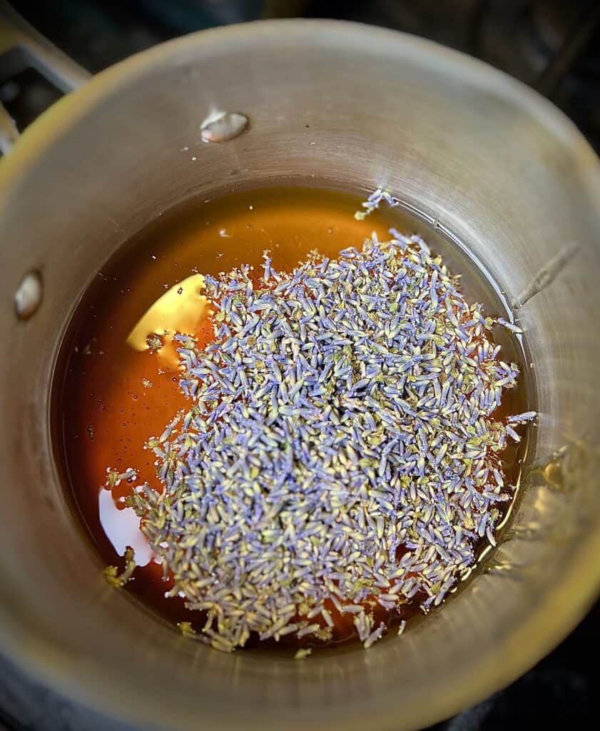 pot filled with honey, water and lavender.