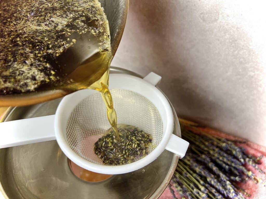 Straining lavender simple syrup.