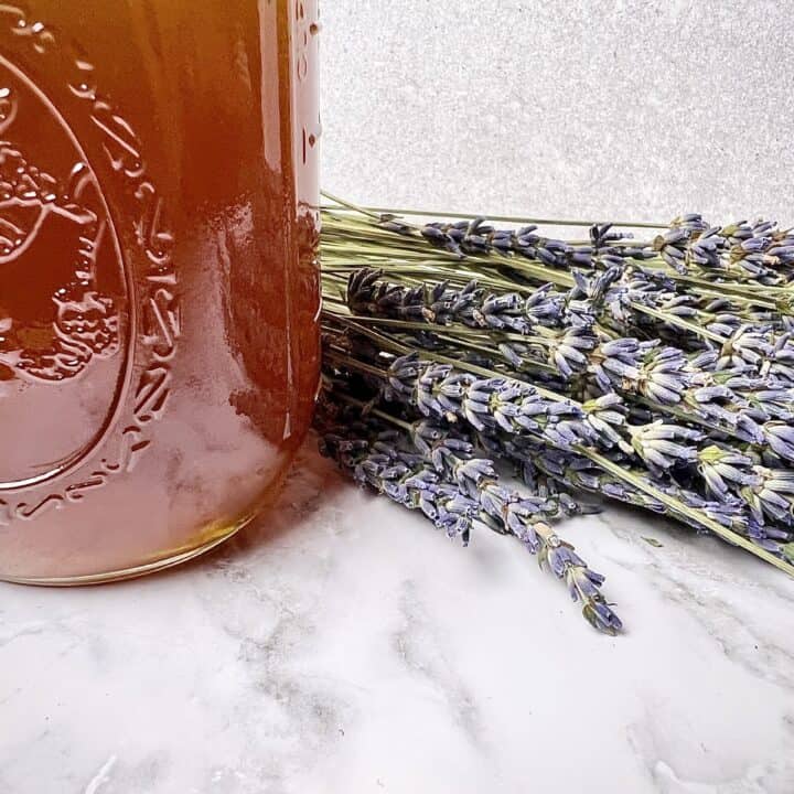 Lavender honey syrup and lavender flowers.