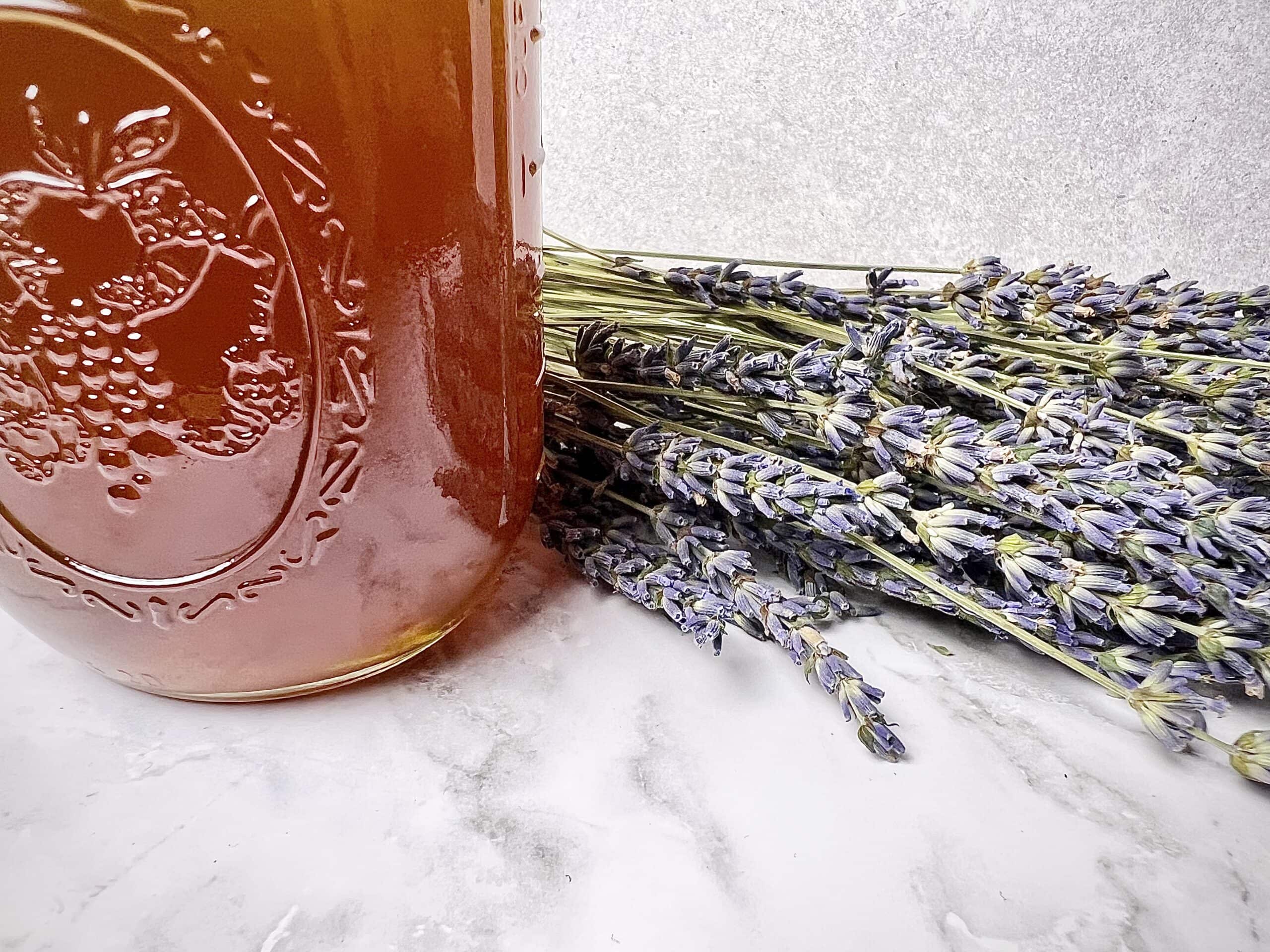 Lavender honey syrup and lavender flowers.