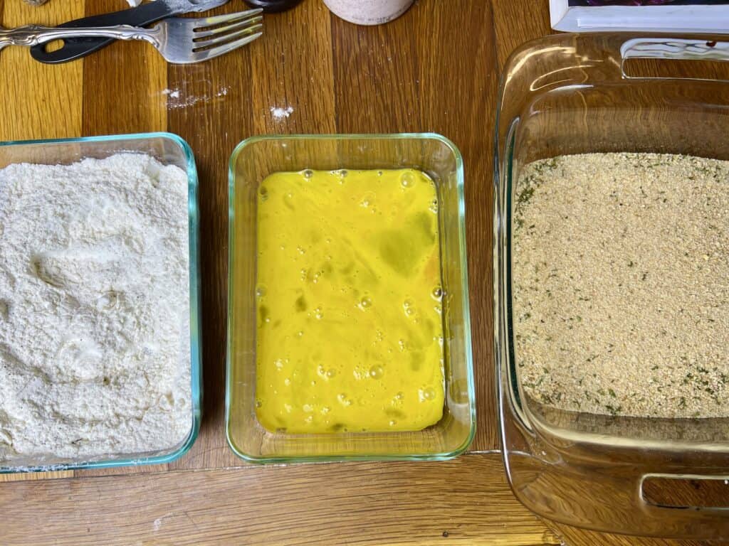 bowl of flour, bowl of egg, bowl of breadcrumbs