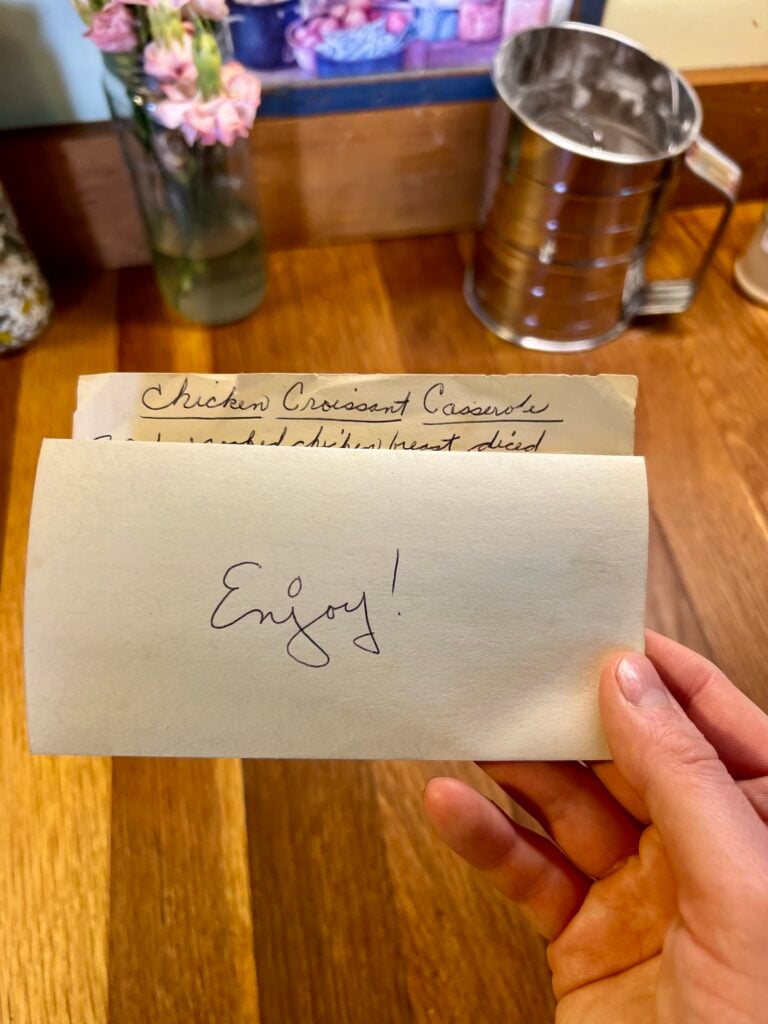 This is a old fashioned handwritten recipes card that was written for someone. it was folded up and "enjoy" was written on it. That's what the picture is showing.