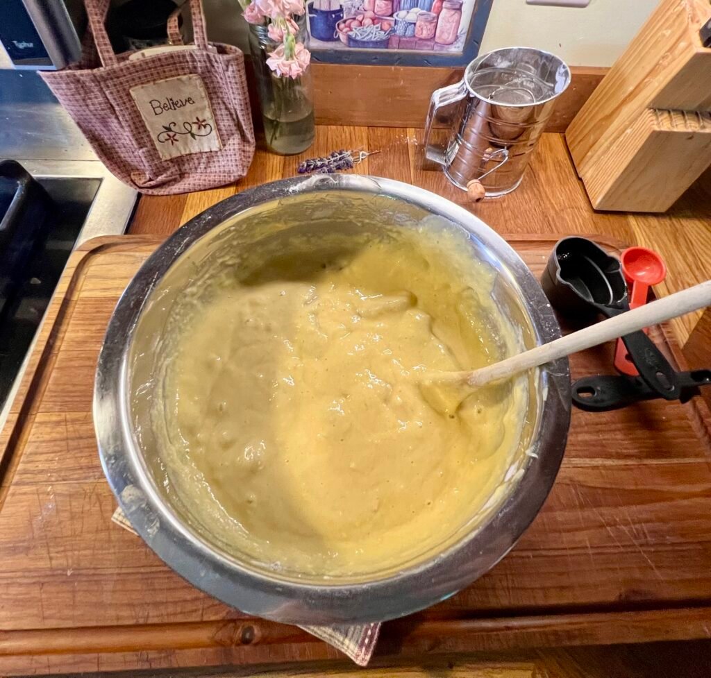 A bowl of the wet ingredients being mixed together.