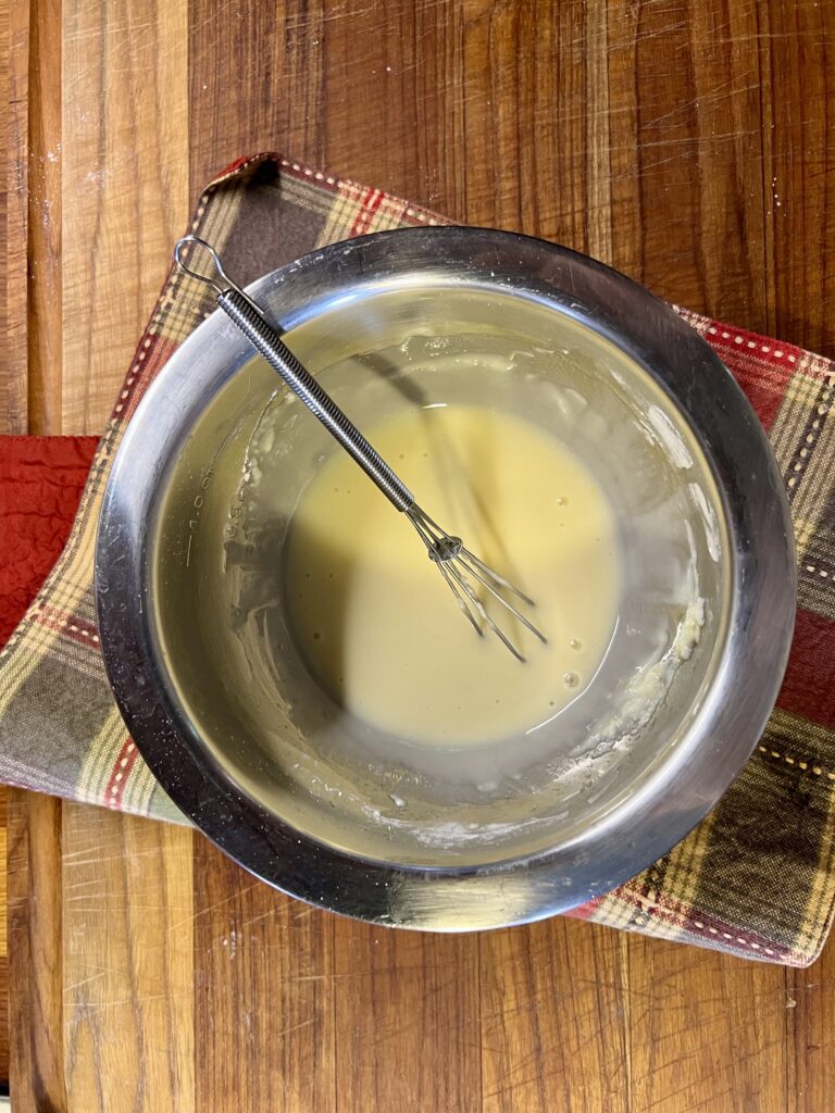 A bowl of the wet batter for this quick bread recipe. 