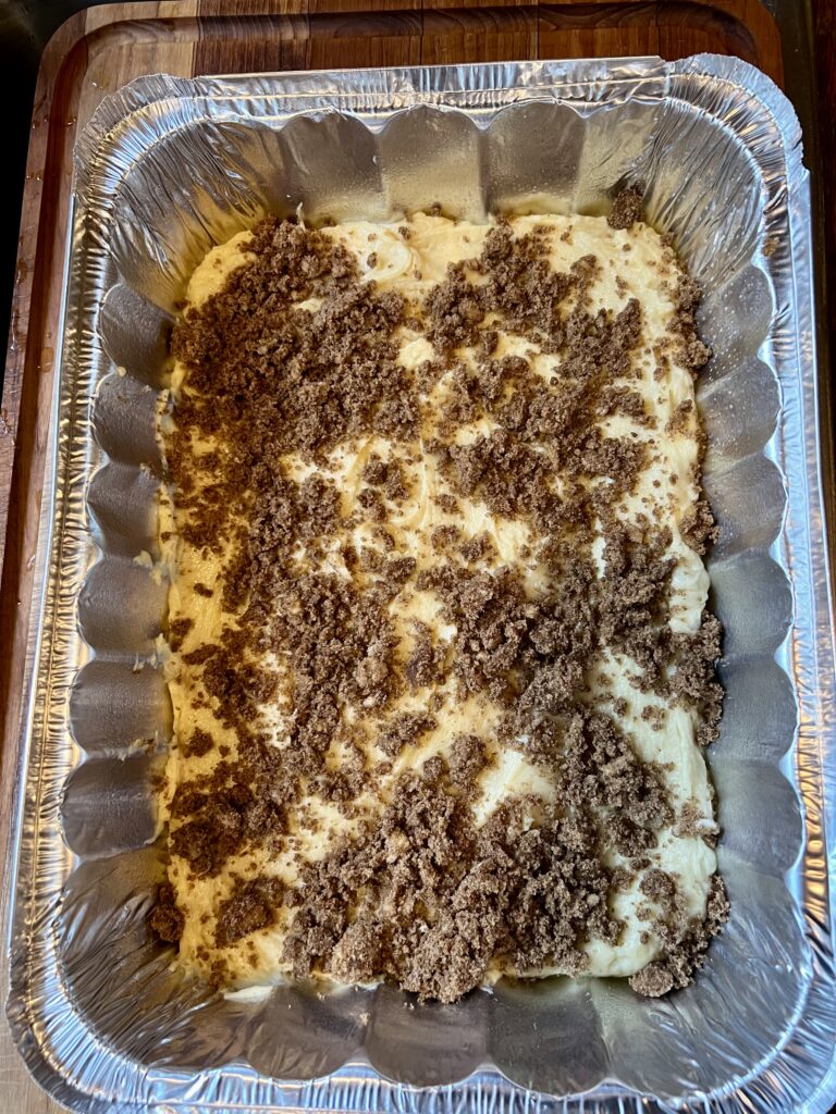 Last, add the rest of the Cinnamon sugar topping to the pumpkin coffee cake. 