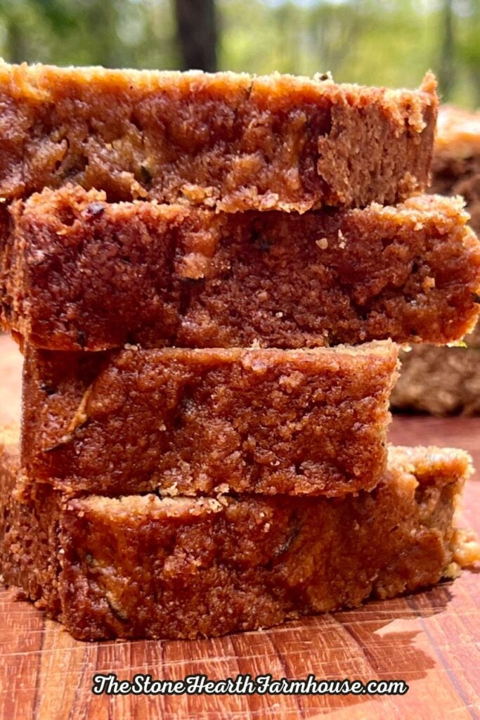 Stack of moist whole grain zucchini bread slices with a soft crumb and rich homemade flavor.