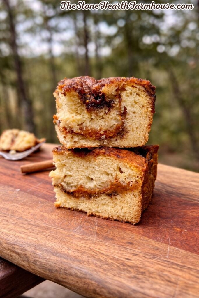 Slices of moist pumpkin cake layered with cinnamon filling and topped with a crunchy brown sugar streusel.