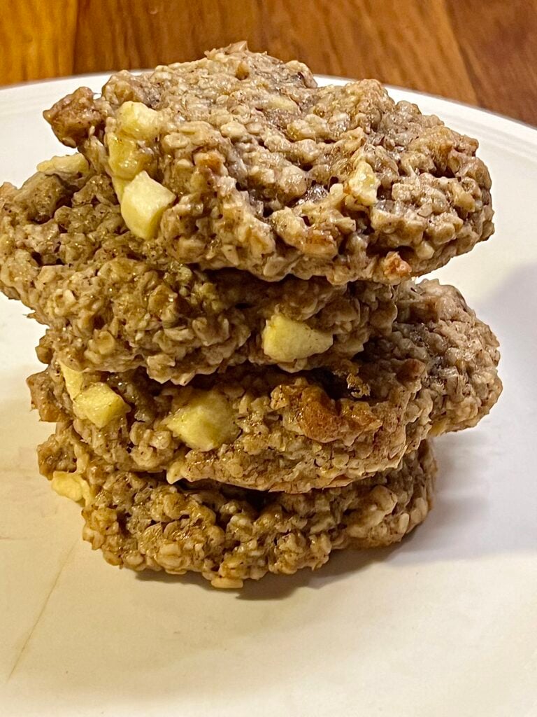 A stack of apple oatmeal cookies on a plate to show how yummy they look. 