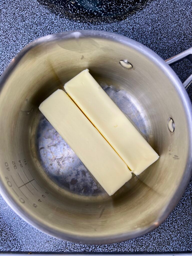 Brown butter melting in a saucepan for brown butter sourdough chocolate chip cookies