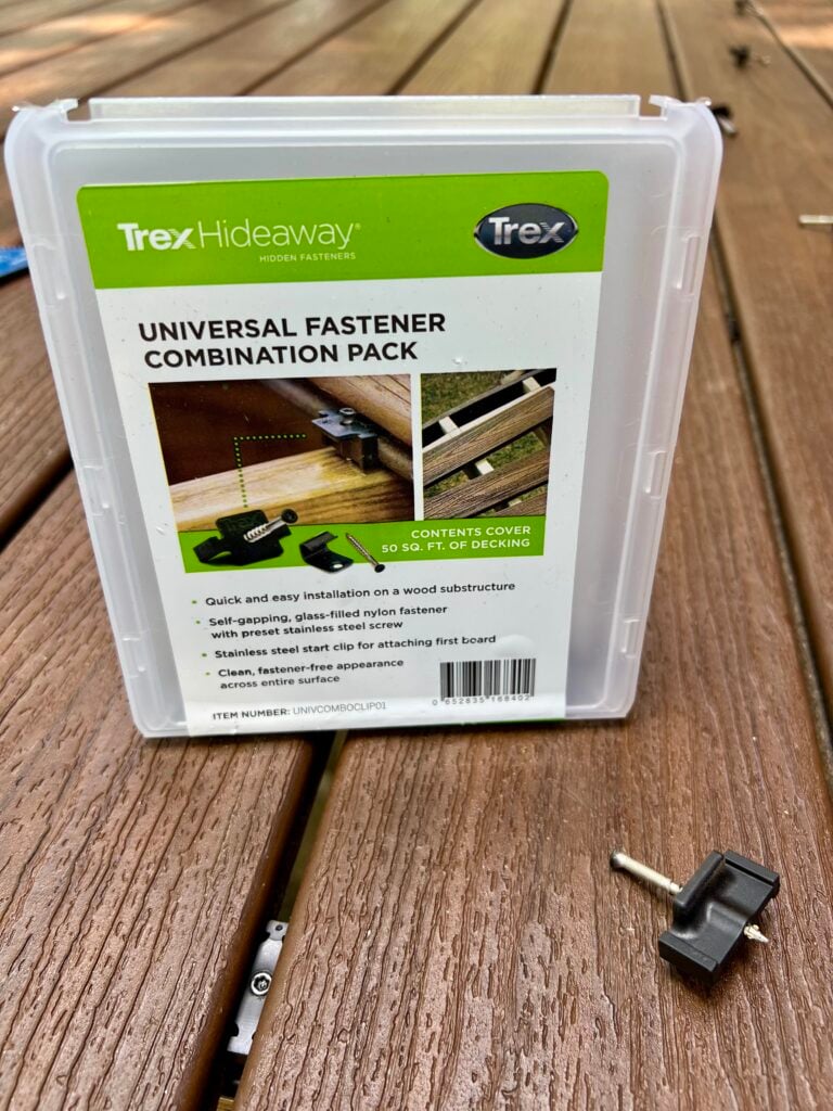 Finished Trex deck surface overlooking wooded backyard landscape