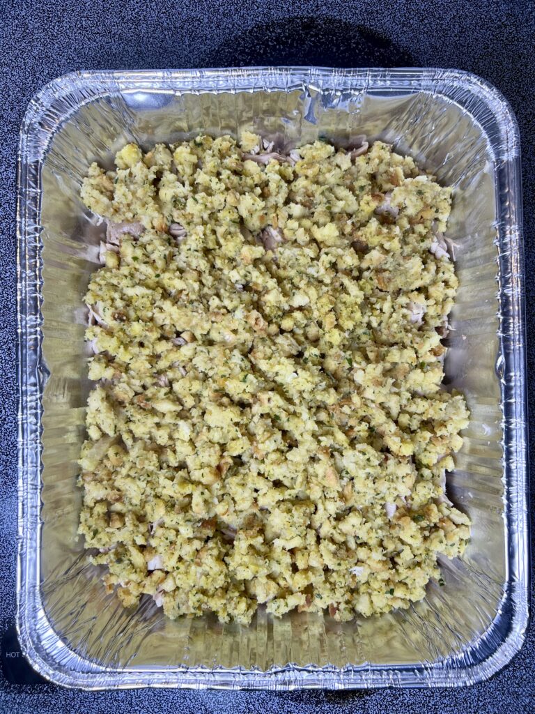 Stuffing layer in a thanksgiving casserole with leftovers.