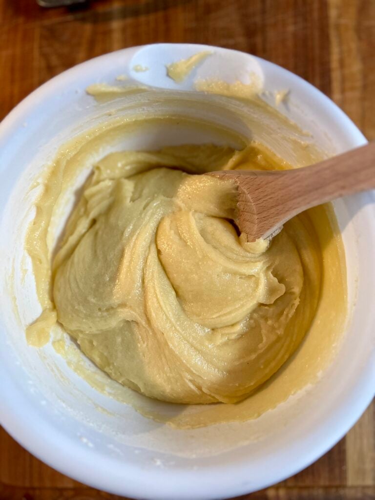 Creamed ranger cookie dough with butter, sugar, and eggs mixed until smooth