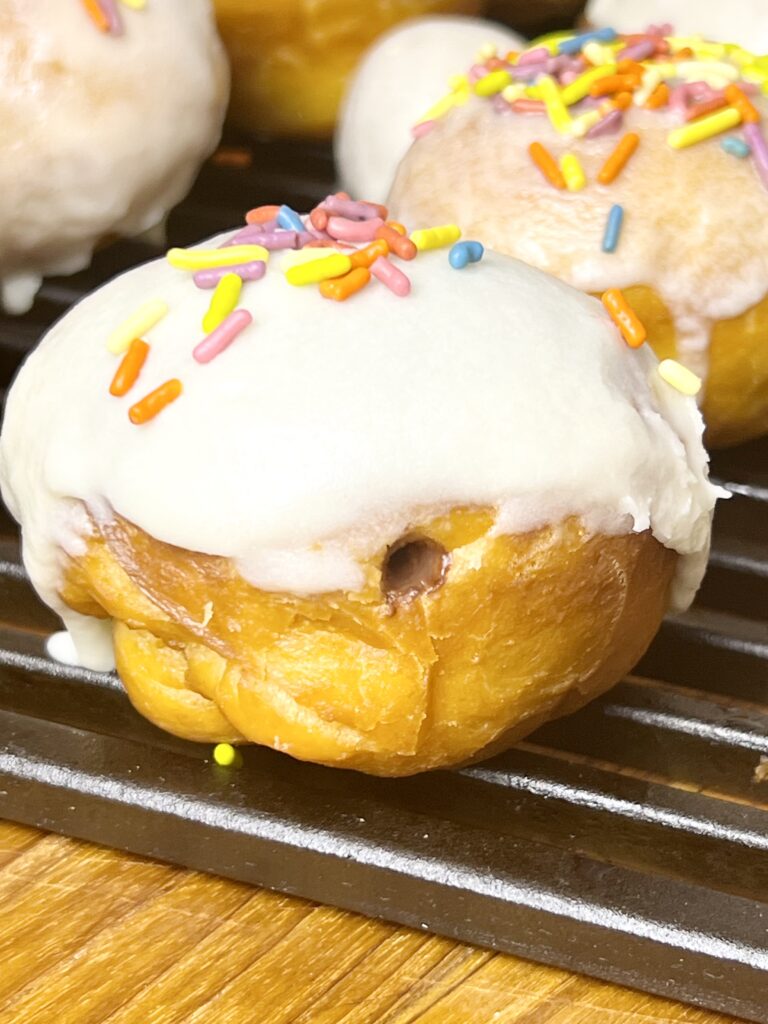 This is a donut that has chocolate pudding inside for the filling.
