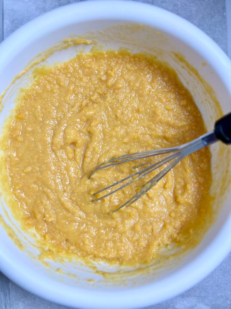 Sweet potato casserole filling mixture made with canned yams, eggs, sugar, butter, and milk blended until smooth and creamy.