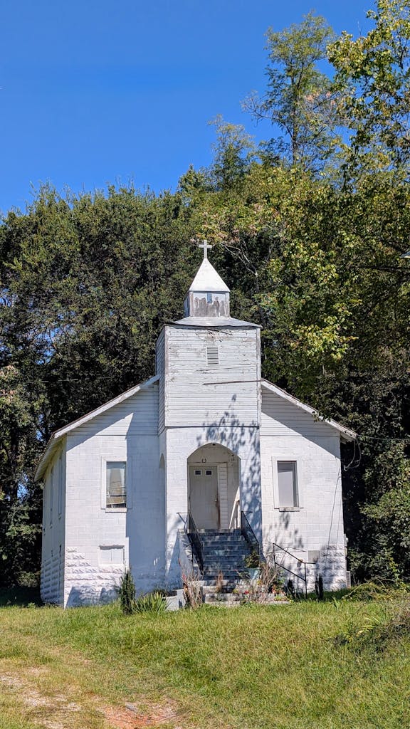Charming historic white church with rustic architecture in Marion, North Carolina.