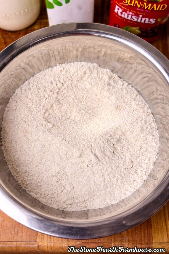 dry ingredients for sourdough Irish soda bread recipe in large mixing bowl with flour mixture