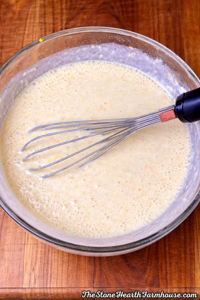 wet ingredients for sourdough Irish soda bread recipe being whisked in glass bowl