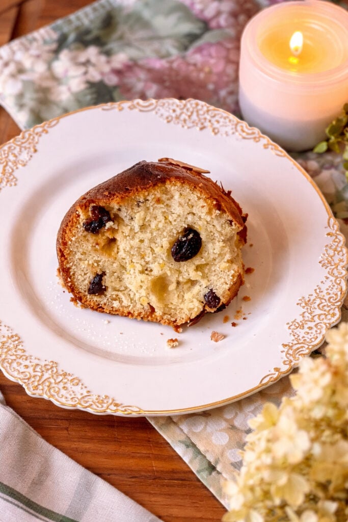 Slice of homemade babka bread with raisins on a plate, soft and tender sweet yeast bread with citrus flavor