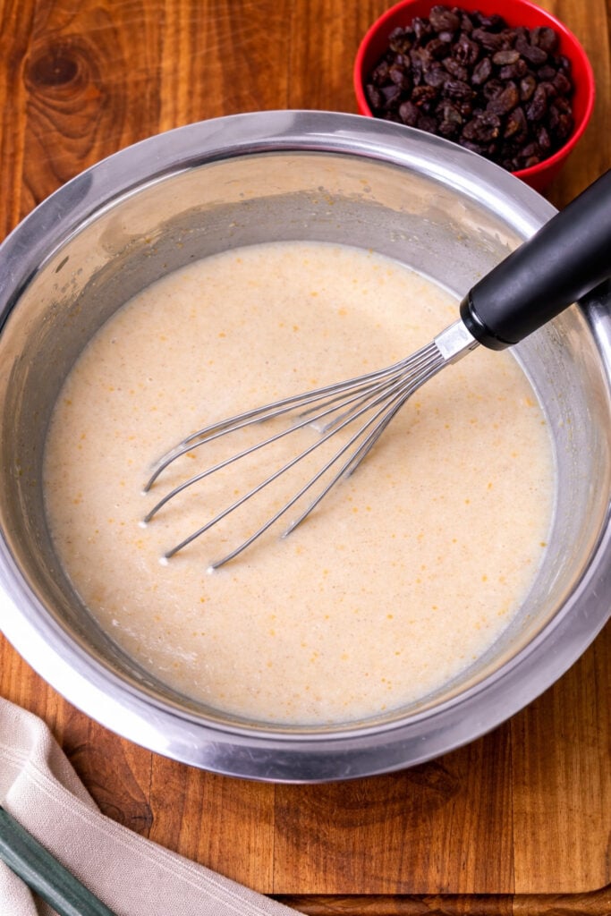 Babka dough mixture with milk, citrus zest, and vanilla extract in a mixing bowl, preparing enriched sweet bread dough