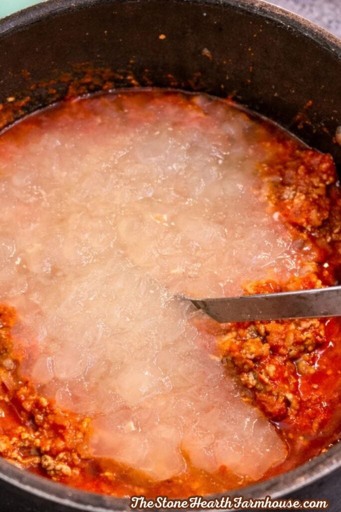 Easy homemade American chop suey with ground beef and macaroni served in a large pot