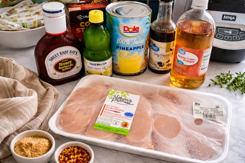 Huli Huli chicken ingredients including soy sauce pineapple juice brown sugar barbecue sauce and chicken breasts