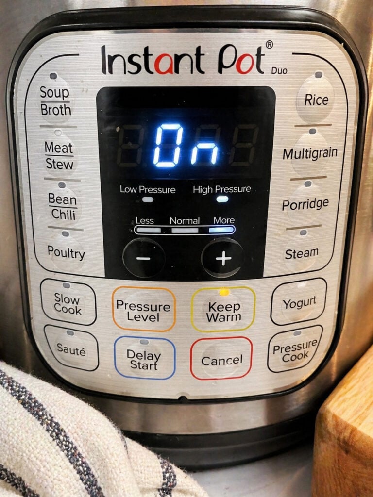Instant Pot set to pressure cook for instant pot chicken broccoli pasta recipe