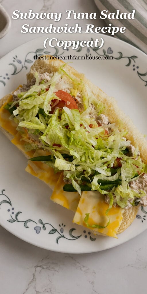Pinterest graphic for a copycat tuna salad sandwich recipe featuring a homemade tuna sub with shredded lettuce, tomatoes, green peppers, cheese, and creamy tuna salad on a hoagie roll.