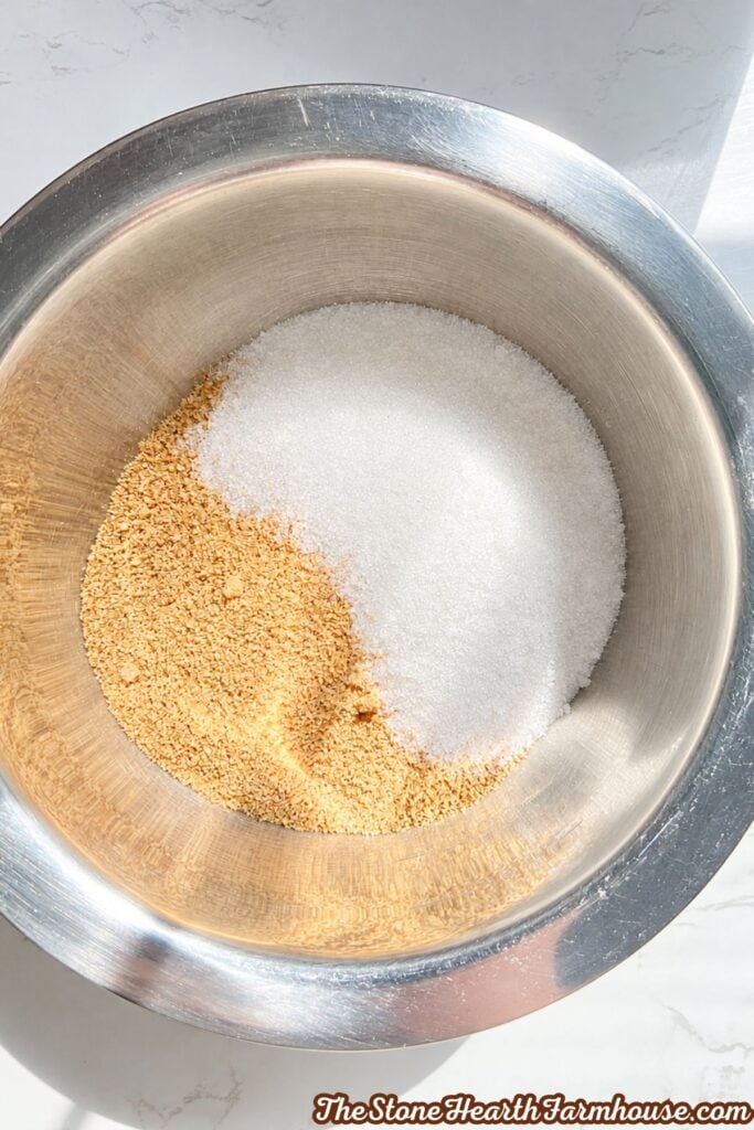 Graham cracker crumbs and granulated sugar combined in a bowl for  crust