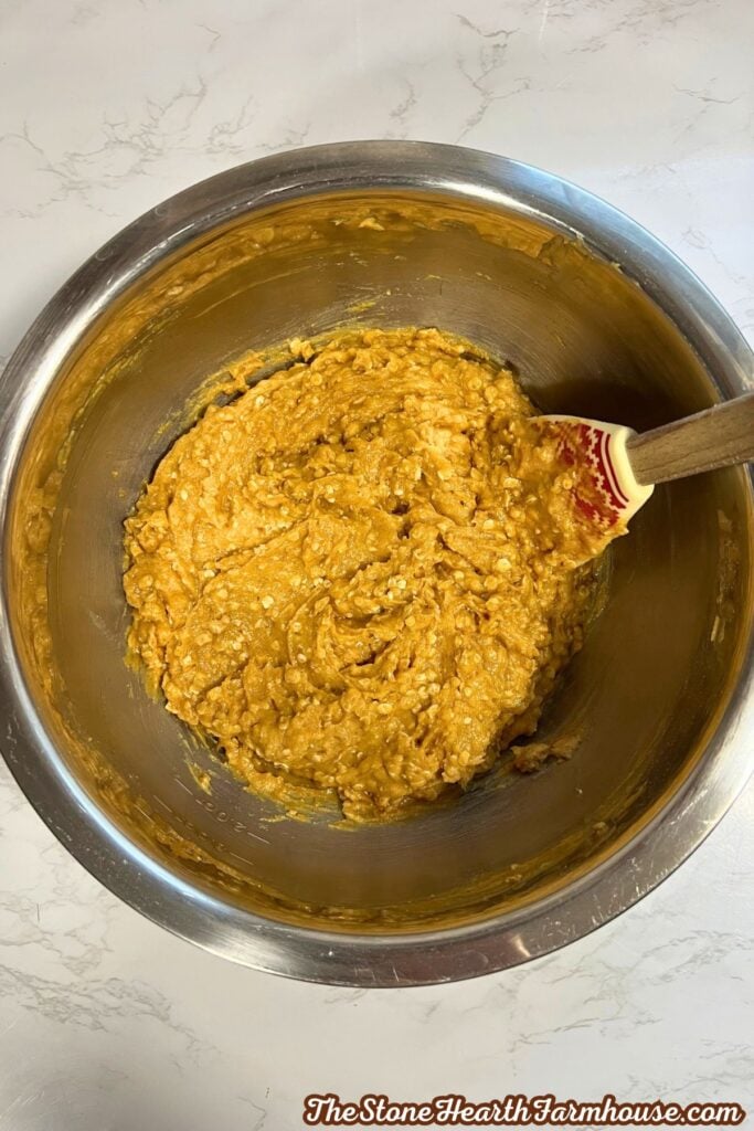 adding the wet and dry ingredients together. 