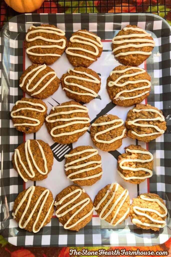 17 cookies with cream cheese frosting on a pretty fall try, ready to be enjoyed. 