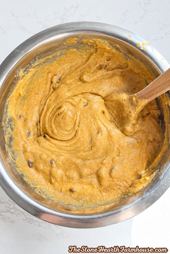 pumpkin cranberry bread batter with cranberries mixed in. 
