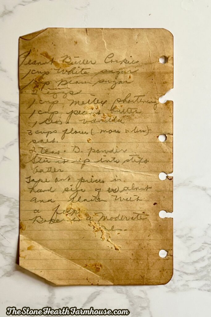 an old fashioned handwritten recipe card for peanut butter cookies.